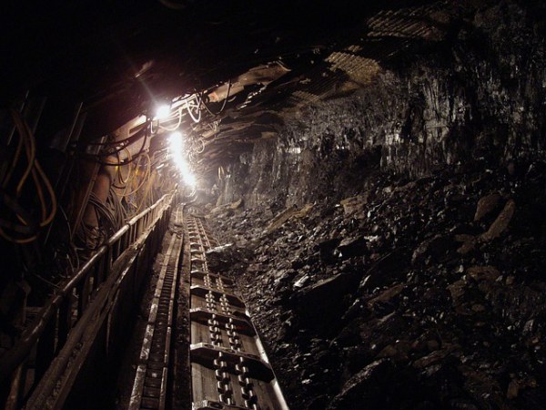 A coal mine showing a light at the end of the tunnel