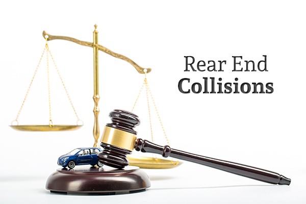 A gavel and a toy car with a scale in the background and the words "Rear End Collisions"