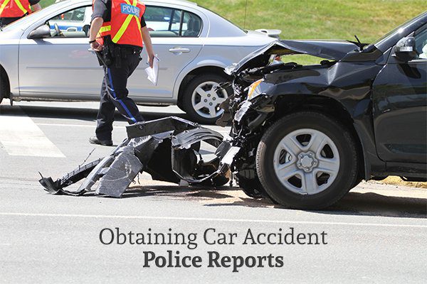 A destroyed car after an auto accident above the words "Obtaining Car Accident Police Reports"