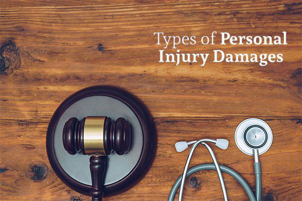 A wooden desk with a gavel and a stethoscope below the words types of personal injury damages