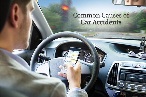 A man texting while driving under the words common causes of car accidents