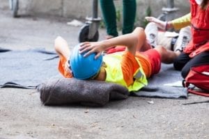 Employee receiving first aid after a workplace accident