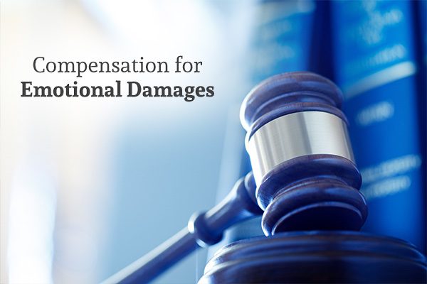 A close up of a gavel with the words, compensation for emotional damages.