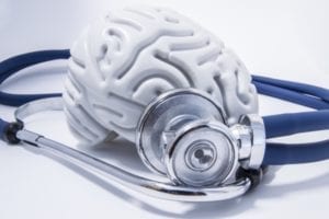 Una imagen de un cerebro rodeado por un estetoscopio.
