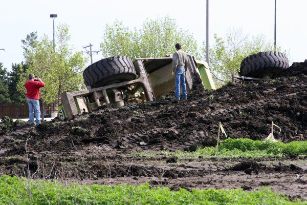 A heavy machine has turned over on a job site.