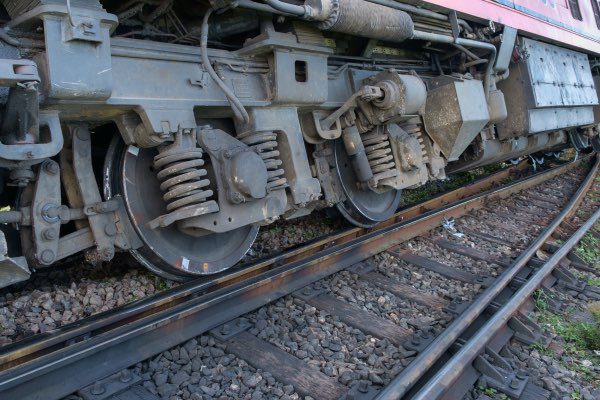 A train has derailed on a track.