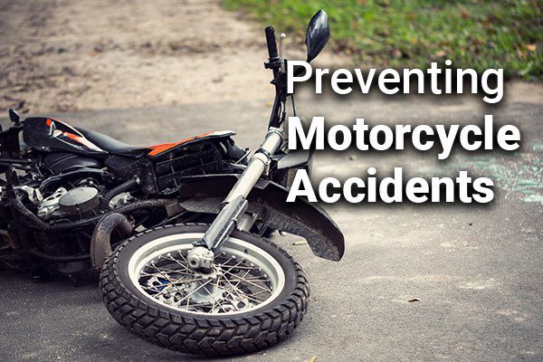 A motorcycle on its side with the words, preventing motorcycle accidents.