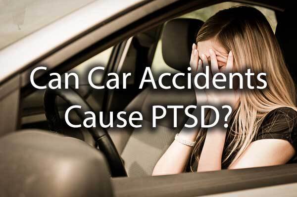 A lady holding her head in the car with the words, "can car accidents cause PTSD?"