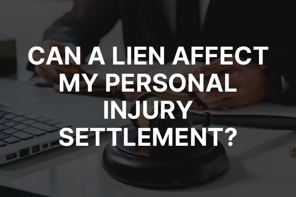 A lawyer working with the words, "Can a Lien Affect My Personal Injury Settlement?"