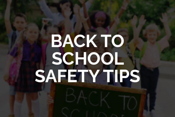 A bunch of kids going back to school with the words, "back to school safety tips."