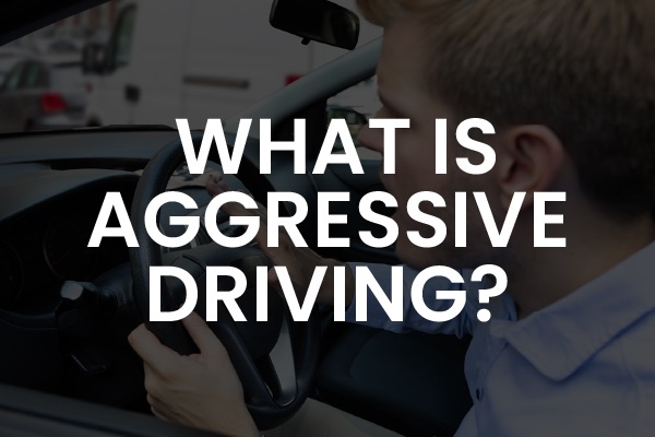 A person clutching the wheel of a car with the words, "what is aggressive driving?"