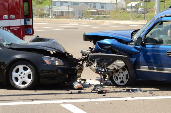 Two cars hitting head on.